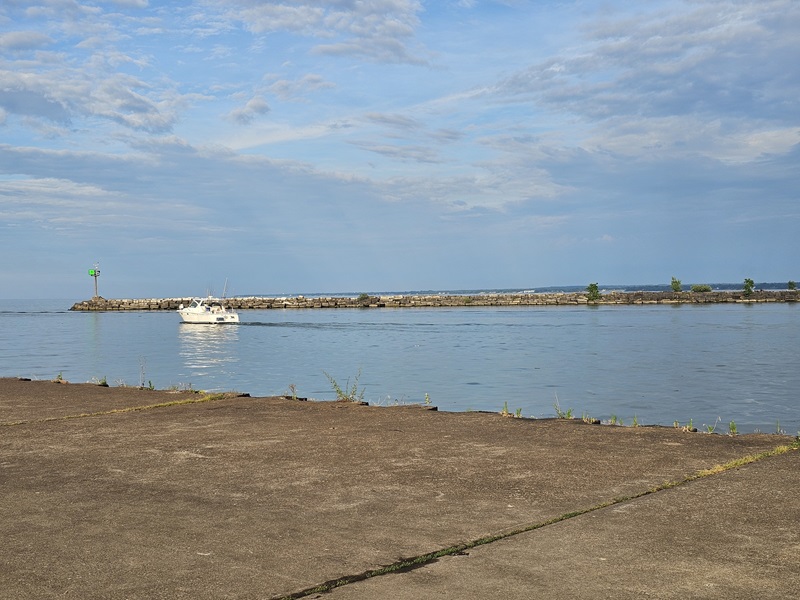 The pier leading up to the viewing platform, with a glimpse of the lighthouse off in the distance
