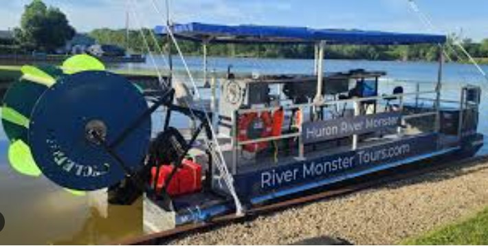 View of the tour pontoon-style boat docked at the river-front