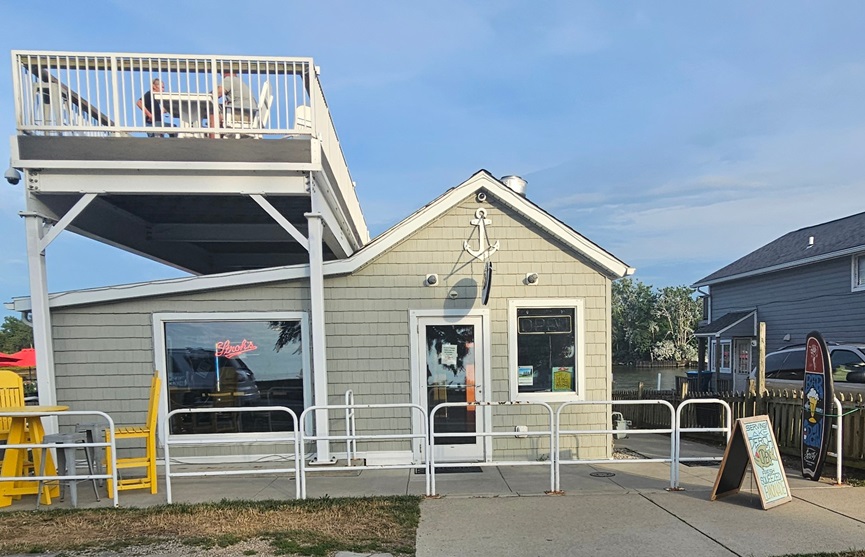 Front of the main Old Fish House building, with view of the rooftop patio