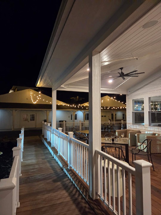 Night view of the Beach Glass Lounge patio, with fairy lights decorating the rooftop